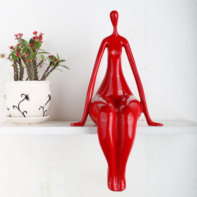 "Handcrafted Red Woman Sculpture''