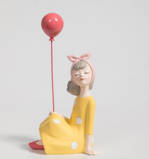 "Sculpture of a Girl with Bow and Balloon "