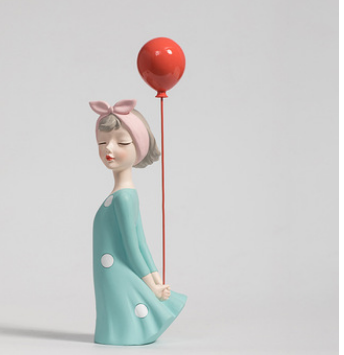 "Sculpture of a Girl with Bow and Balloon "