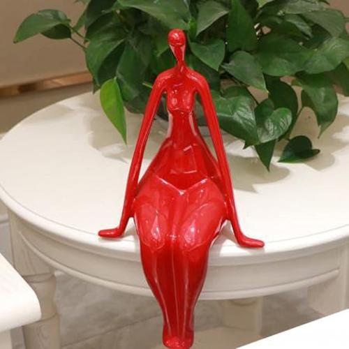 "Red Woman Statue: Modern and Provocative Art for Creative Decor"